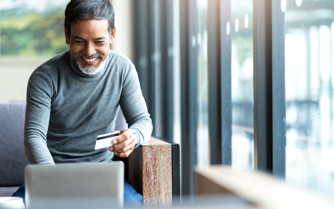 Man paying his bill on a computer